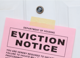 The Oregon landlord for a man charged with murder of an apartment resident who lived across the hall from him has won an eviction order