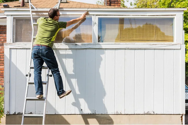 For rental property maintenance ladder safety training should include four employees: one on the ladder and two to three on the ground. 